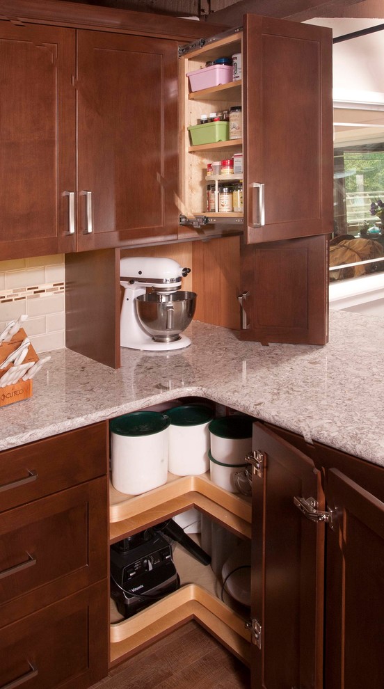 Kitchen - mid-sized transitional dark wood floor kitchen idea in Seattle with an undermount sink, shaker cabinets, dark wood cabinets, beige backsplash, subway tile backsplash, stainless steel appliances and a peninsula