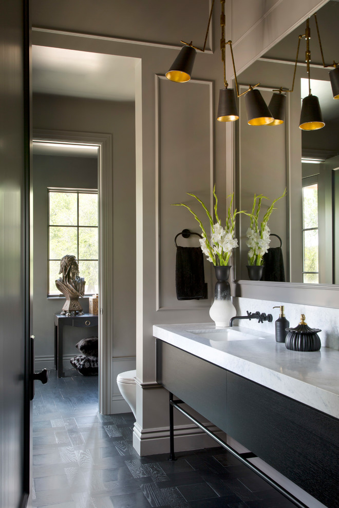 This is an example of a transitional bathroom in Denver with flat-panel cabinets, black cabinets, grey walls, dark hardwood floors, an undermount sink, black floor and white benchtops.