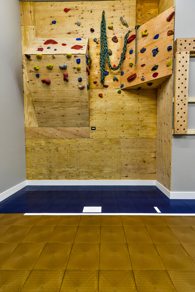 This is an example of a large country home climbing wall in Minneapolis with grey walls.