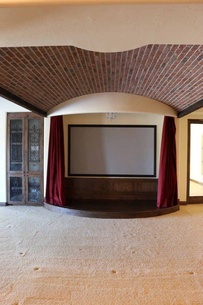 Design ideas for a large country open concept home theatre in Denver with beige walls, carpet and a wall-mounted tv.