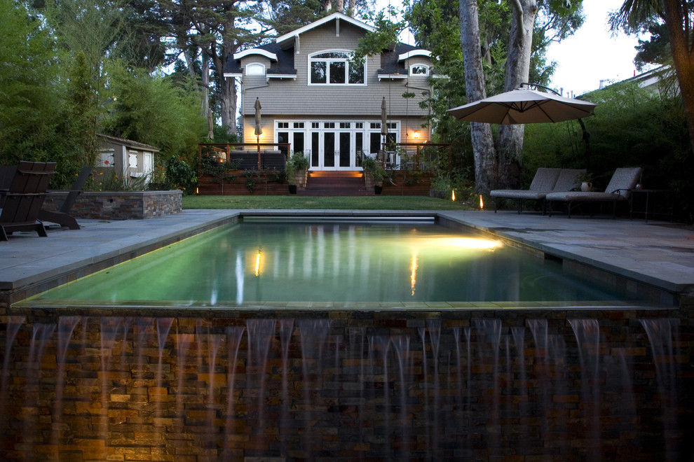 Photo of a contemporary backyard garden in San Francisco with a water feature.
