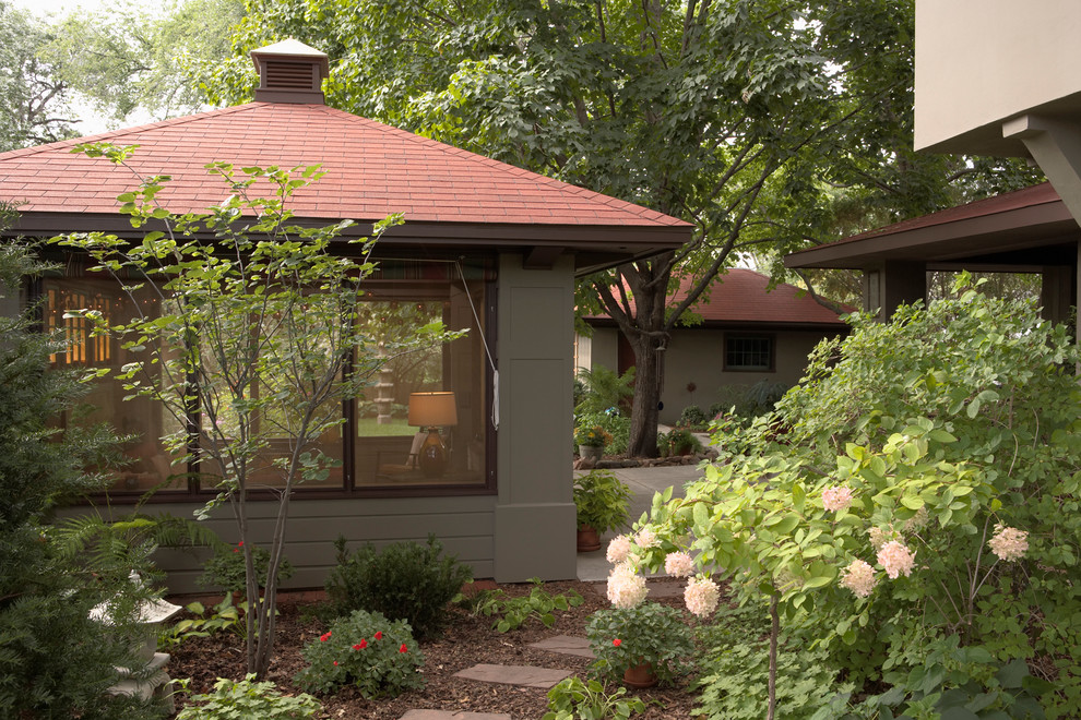 This is an example of an arts and crafts backyard screened-in verandah in Minneapolis.