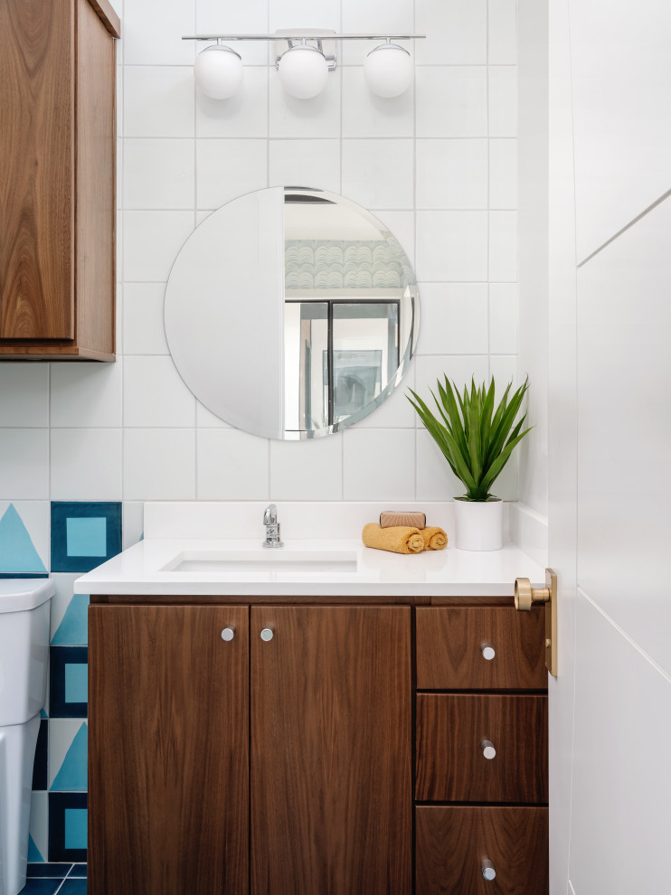 Inspiration for a mid-sized midcentury master bathroom in Austin with flat-panel cabinets, brown cabinets, a freestanding tub, an open shower, white tile, ceramic tile, porcelain floors, a drop-in sink, engineered quartz benchtops, turquoise floor, an open shower, white benchtops, a double vanity and a floating vanity.