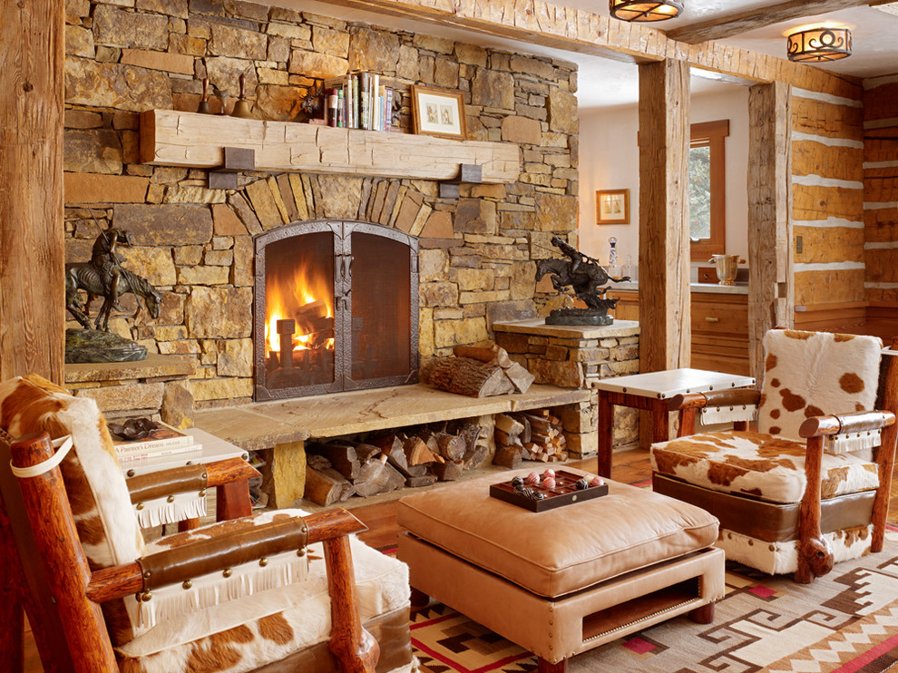 Photo of a country living room in Salt Lake City with a standard fireplace and a stone fireplace surround.