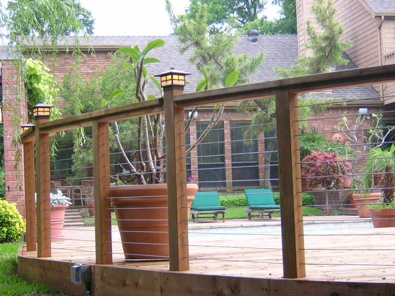 Large transitional backyard deck photo in Dallas with no cover