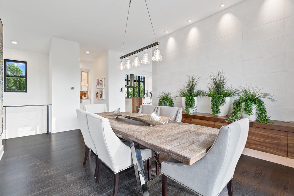 Inspiration for a mid-sized contemporary separate dining room in Minneapolis with white walls, dark hardwood floors, no fireplace and brown floor.
