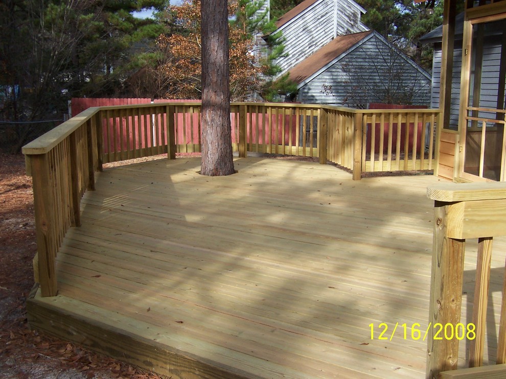 Deck - mid-sized rustic backyard deck idea