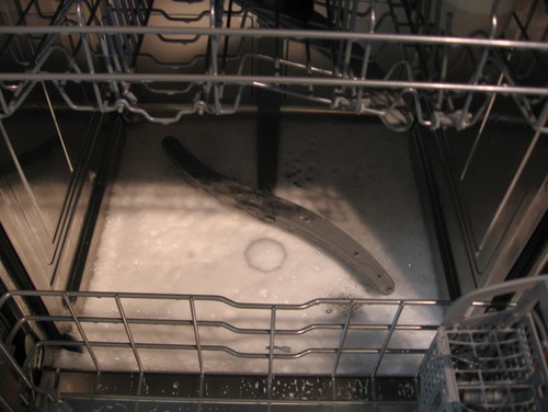 How do you get rid of soap suds in the dishwasher?