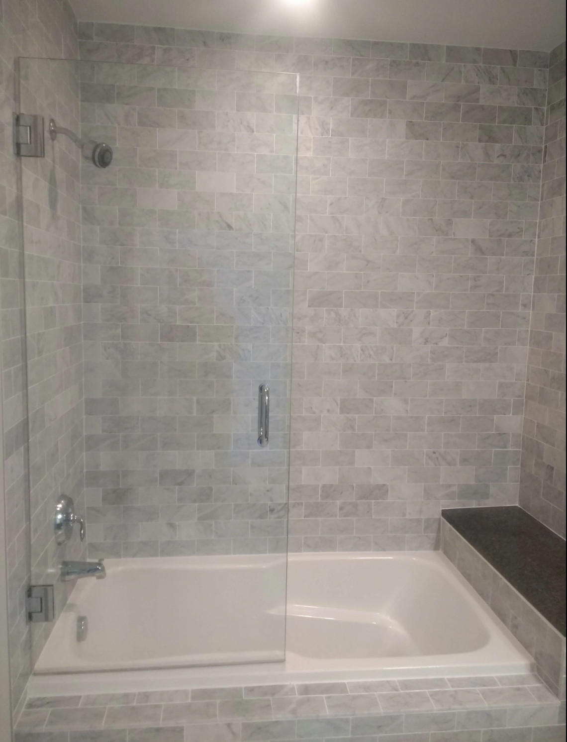 Midtown high-rise marble tile bathroom.