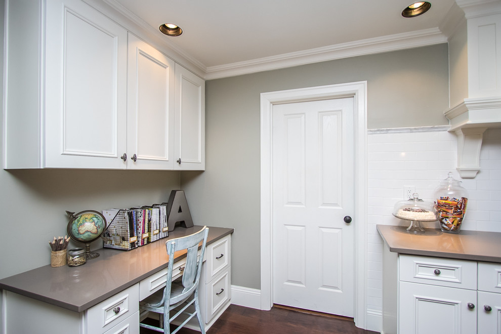 Example of a large transitional u-shaped medium tone wood floor and brown floor eat-in kitchen design in Phoenix with beaded inset cabinets, white cabinets, a double-bowl sink, quartzite countertops, white backsplash, ceramic backsplash, paneled appliances and an island