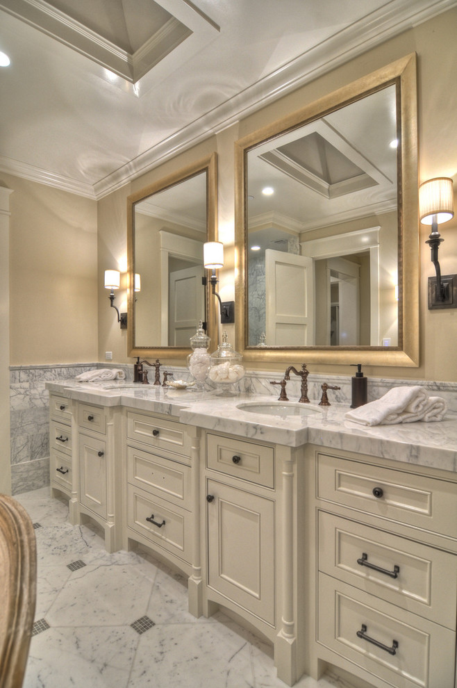 Transitional bathroom in Orange County with marble benchtops.