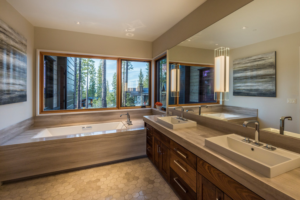 Photo of a country master bathroom in Sacramento with dark wood cabinets, an undermount tub, grey walls, a vessel sink, grey floor and grey benchtops.