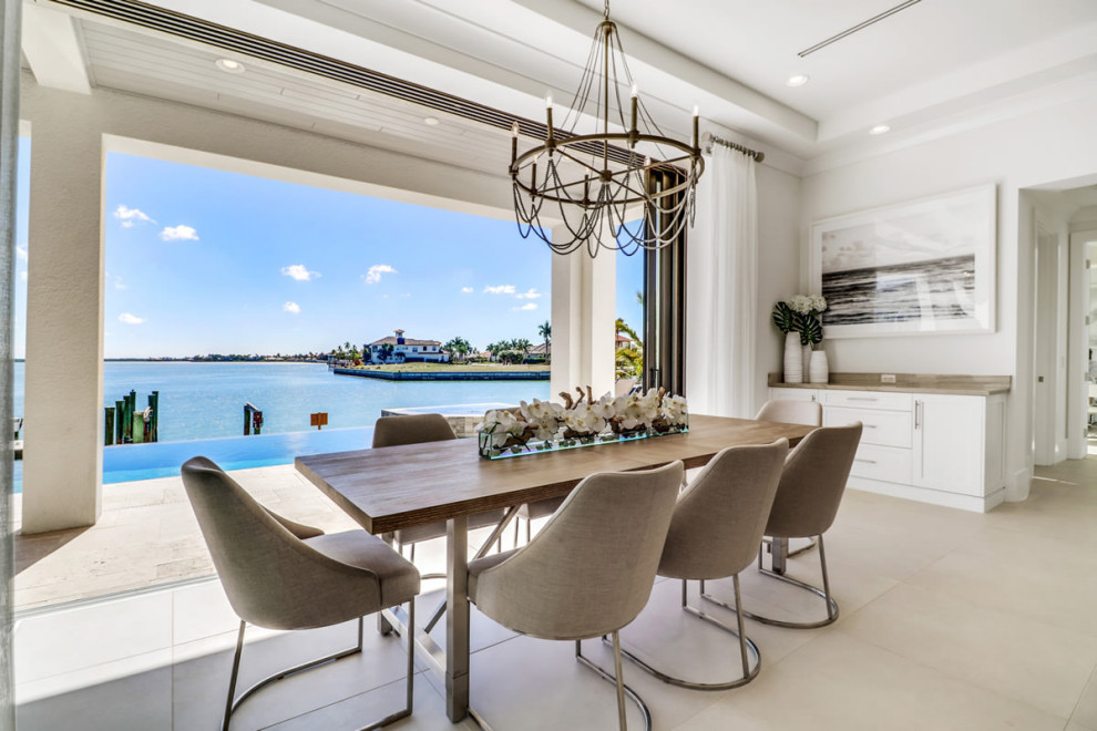 Beach style dining room in Miami.