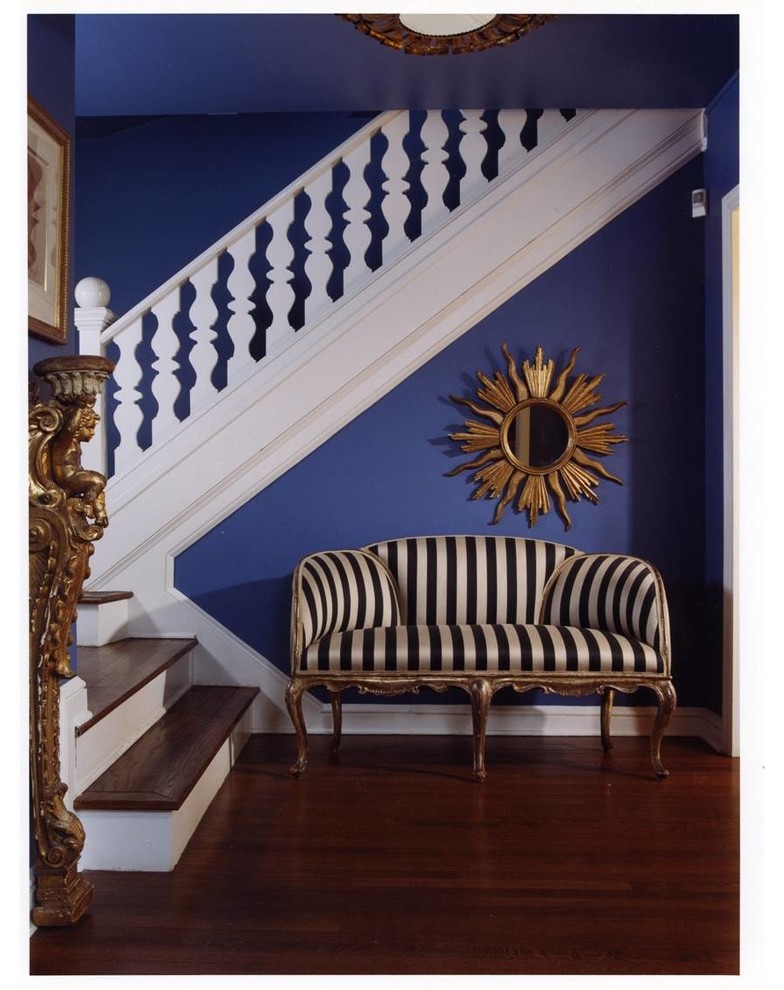 Inspiration for an eclectic foyer in DC Metro with purple walls and dark hardwood floors.
