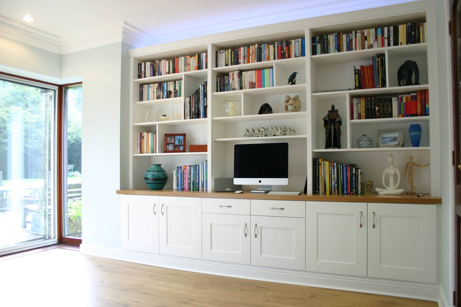 White painted wall shelving with oak top