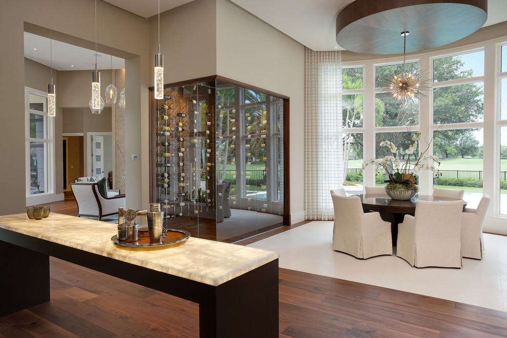 This is an example of a mid-sized contemporary separate dining room in Miami with grey walls, dark hardwood floors, no fireplace and brown floor.