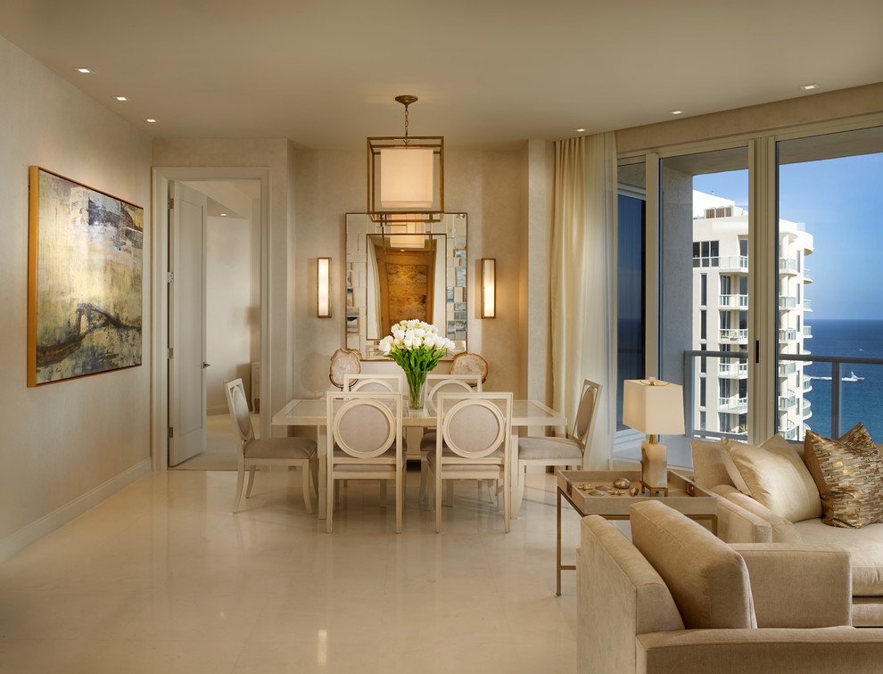 Mid-sized transitional dining room in Miami with beige walls and marble floors.
