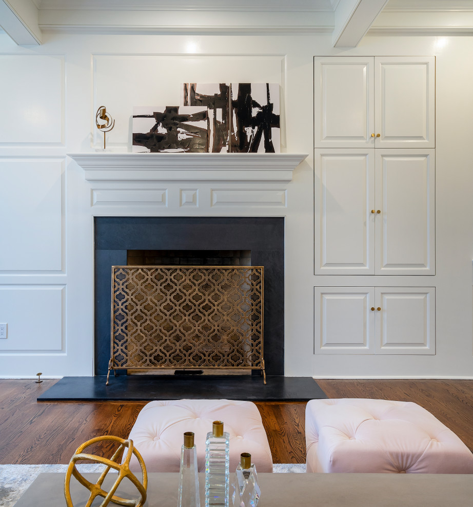 Inspiration for a large transitional open concept family room in Philadelphia with white walls, dark hardwood floors, a standard fireplace, a wall-mounted tv, brown floor, coffered and panelled walls.