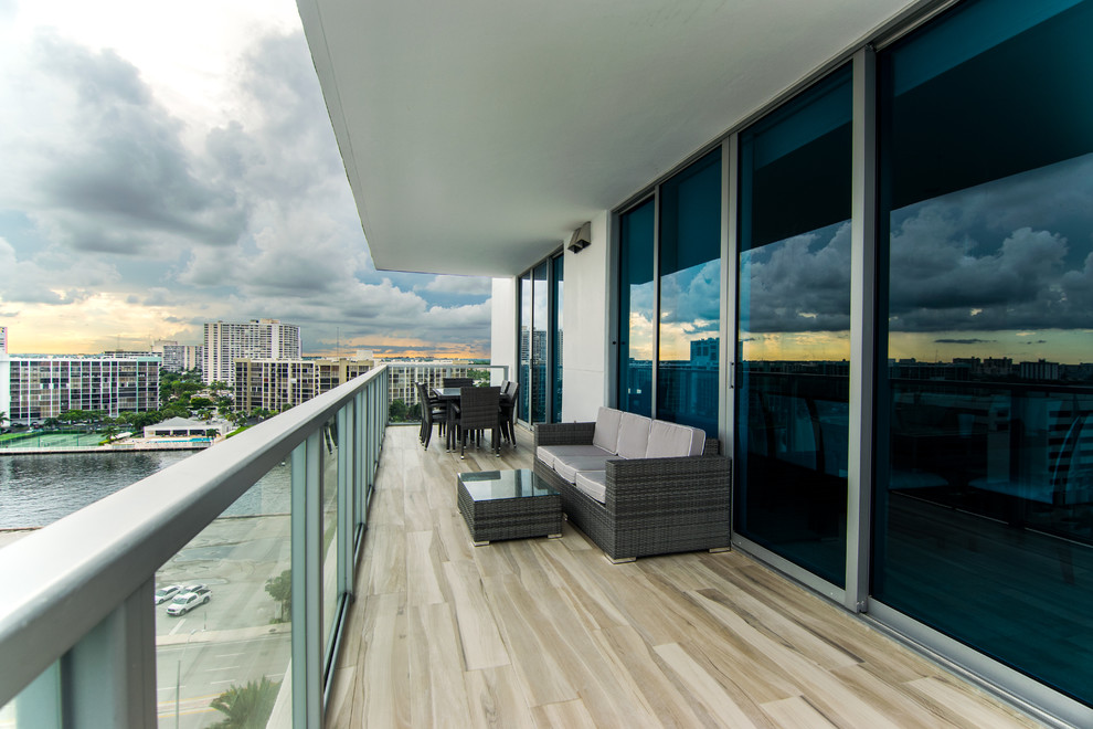 Design ideas for a mid-sized beach style patio in Miami.