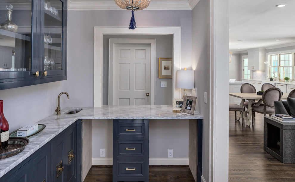 Design ideas for a large transitional l-shaped wet bar in Nashville with an undermount sink, glass-front cabinets, blue cabinets, granite benchtops, dark hardwood floors and brown floor.