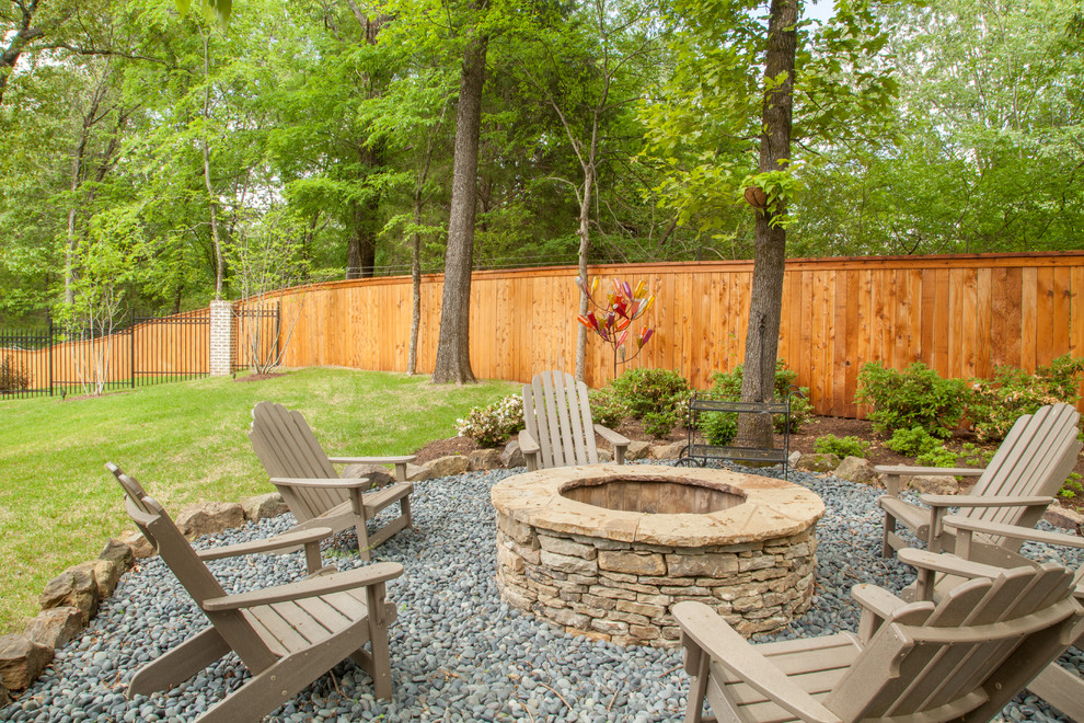 Large traditional backyard partial sun garden in Nashville with a fire feature and gravel for summer.