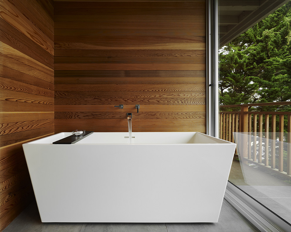 Inspiration for a mid-sized modern master bathroom in San Francisco with a freestanding tub, brown tile, brown walls and grey floor.