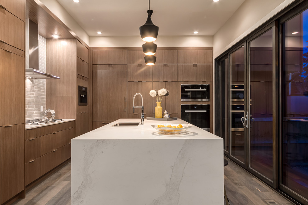 Example of a transitional kitchen design in Calgary