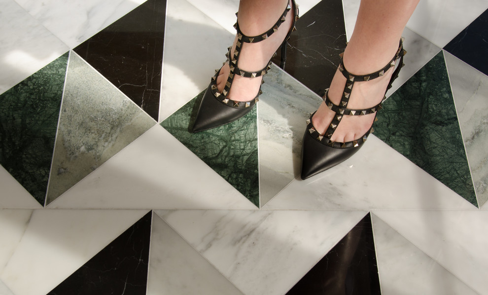 Large transitional marble floor entryway photo with gray walls