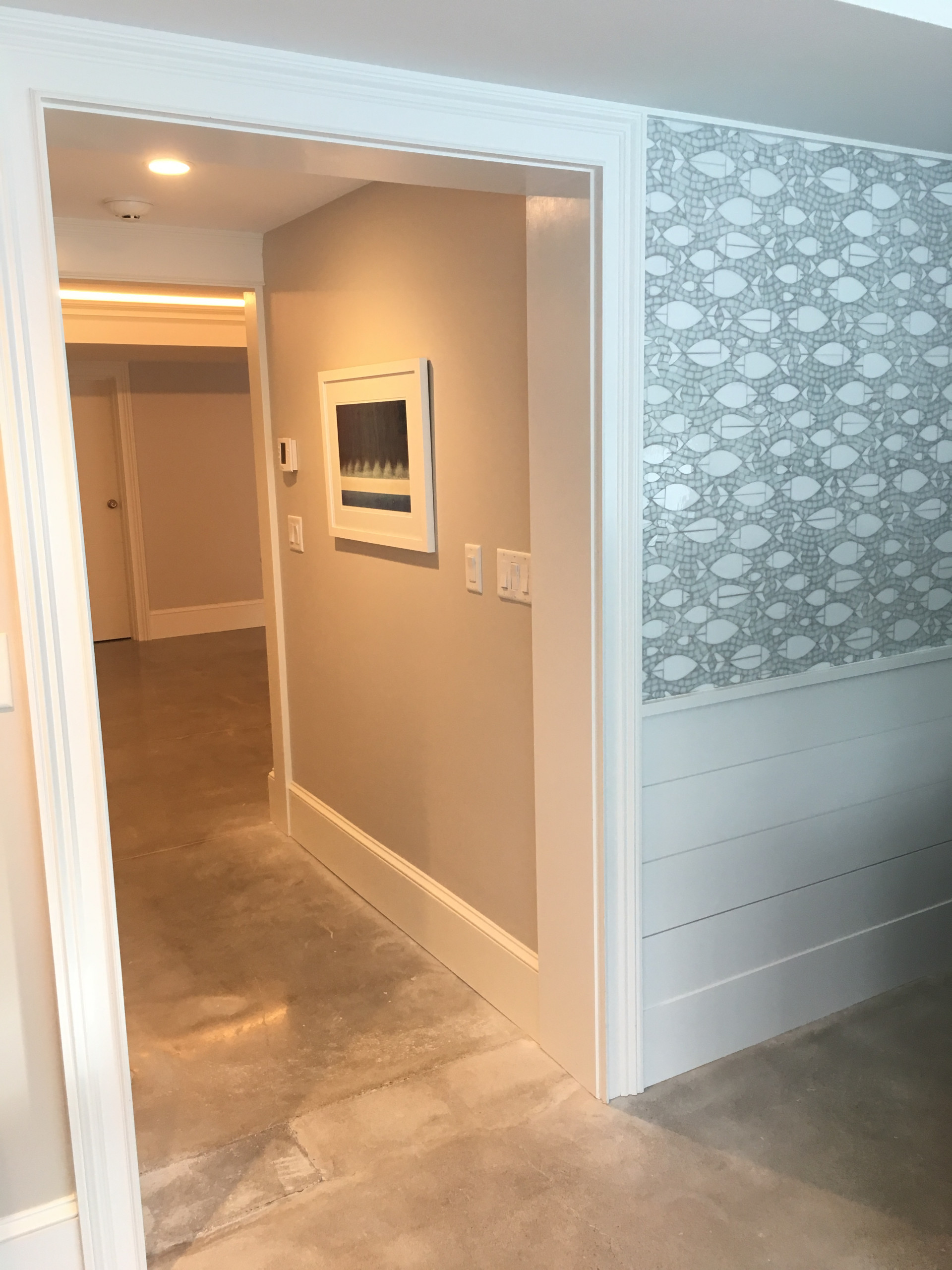 A fully equipped laundry room with a built ins
