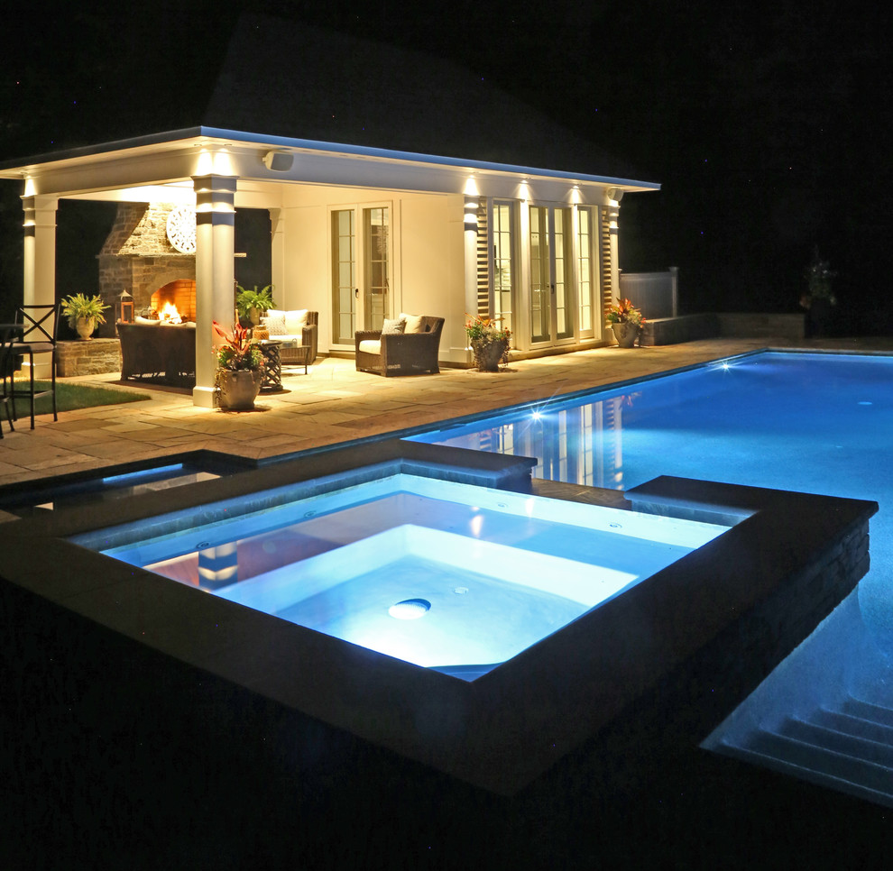 Design ideas for a mid-sized traditional side yard rectangular lap pool in Bridgeport with a pool house.