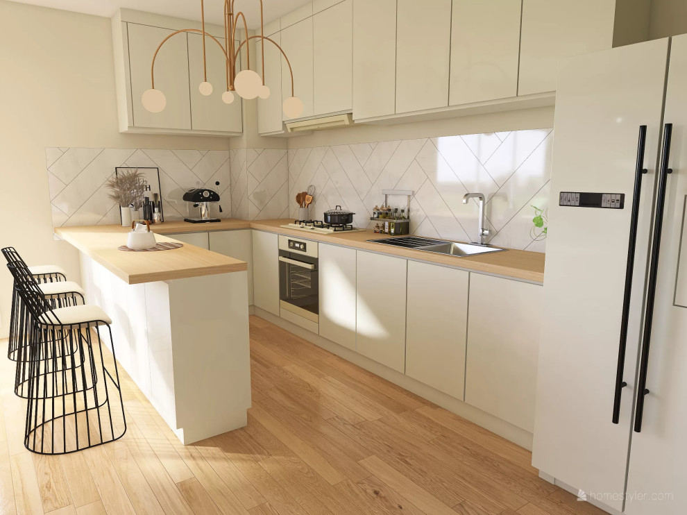 This is an example of a large traditional galley open plan kitchen in Paris with a submerged sink, recessed-panel cabinets, white cabinets, wood worktops, white splashback, porcelain splashback, stainless steel appliances, medium hardwood flooring and an island.