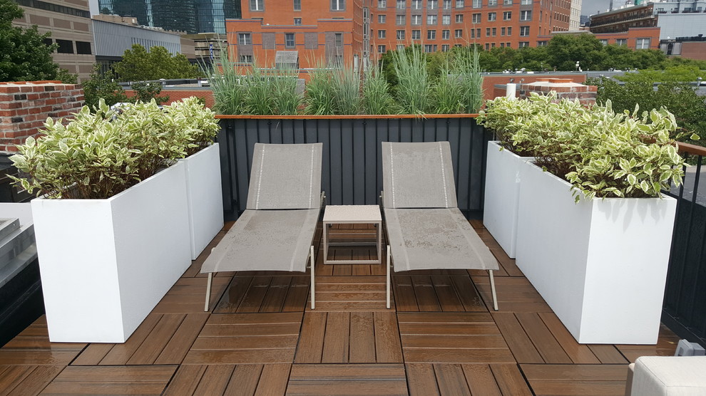 Small contemporary rooftop deck in Boston with a container garden and no cover.