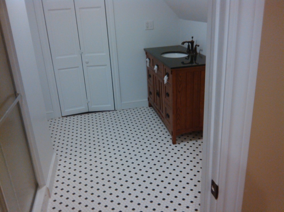Photo of a traditional bathroom in Columbus with mosaic tile floors.