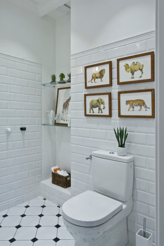Photo of a contemporary powder room in Moscow with a two-piece toilet, white tile, subway tile and white walls.