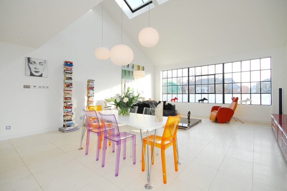 Photo of a contemporary open concept living room in Glasgow with white walls.