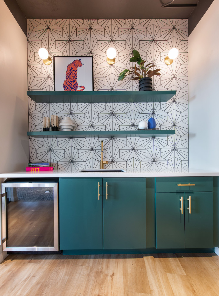 Design ideas for a contemporary wet bar in Denver with a submerged sink, flat-panel cabinets, green cabinets, engineered stone countertops, white splashback, cement tile splashback, vinyl flooring, brown floors and grey worktops.