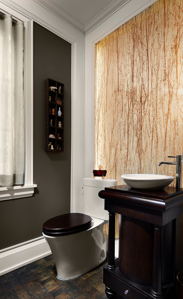 This is an example of a transitional powder room in Chicago with a vessel sink.