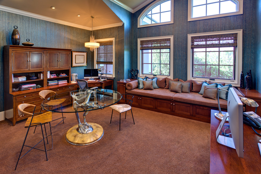 Large traditional study room in Orange County with blue walls, carpet, a freestanding desk and brown floor.