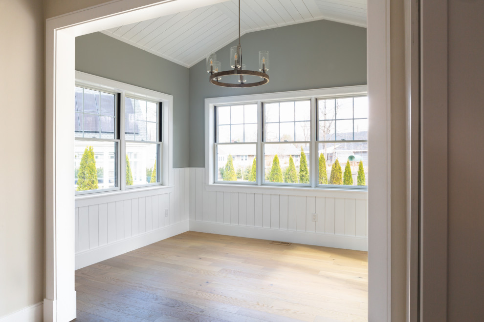 Inspiration for a mid-sized transitional l-shaped light wood floor, beige floor and shiplap ceiling open concept kitchen remodel in Boston with an undermount sink, shaker cabinets, white cabinets, quartz countertops, gray backsplash, porcelain backsplash, stainless steel appliances, an island and white countertops