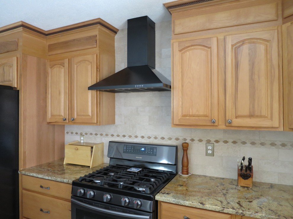 Inspiration for a mid-sized transitional u-shaped ceramic tile and white floor eat-in kitchen remodel in Bridgeport with a double-bowl sink, raised-panel cabinets, light wood cabinets, granite countertops, white backsplash, subway tile backsplash, stainless steel appliances and an island