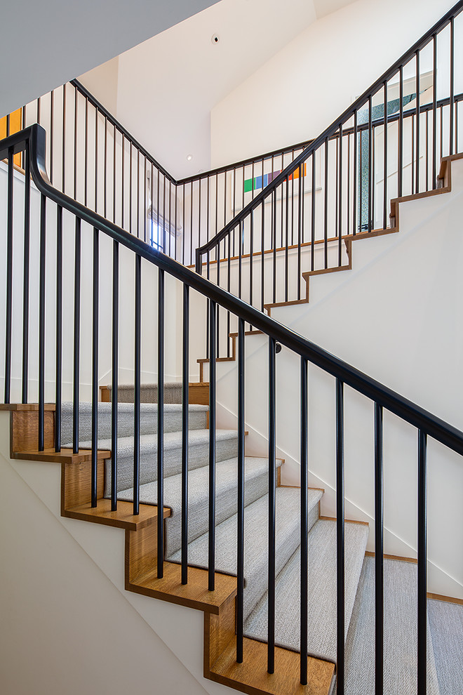 Design ideas for an arts and crafts wood staircase in San Francisco with carpet risers.