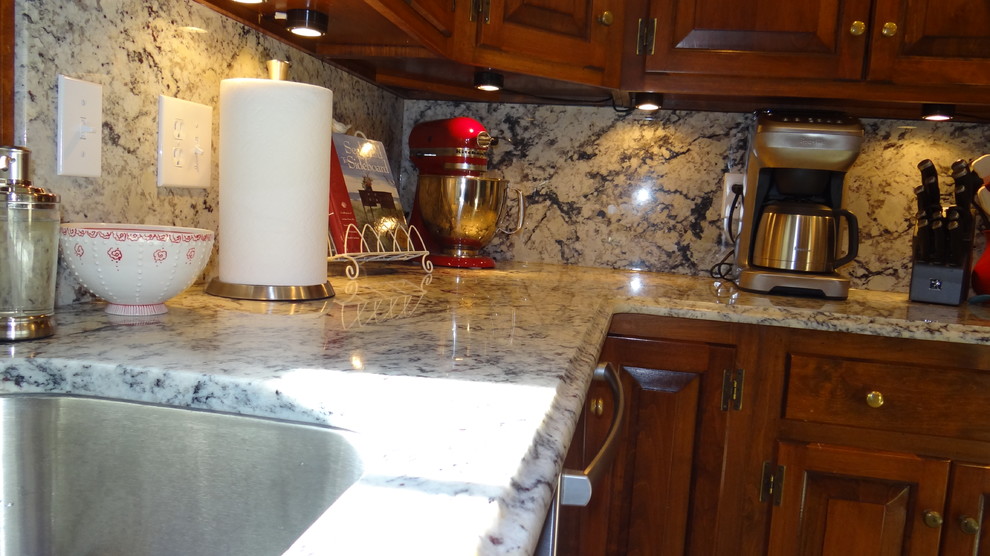 White eyes granite with full height granite backsplash Traditional
