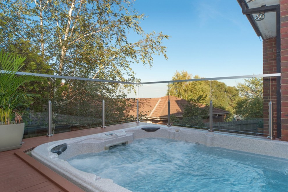 Photo of a contemporary rooftop rectangular pool in Melbourne with a hot tub and decking.