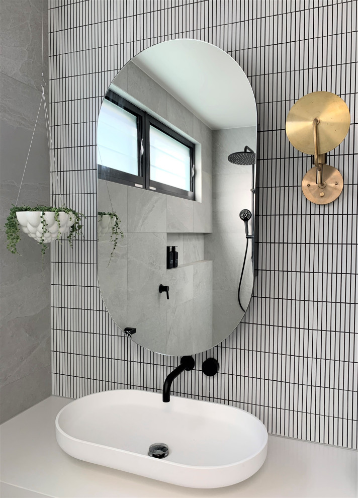Inspiration for a contemporary ensuite bathroom in Melbourne with white cabinets, grey tiles, porcelain tiles, engineered stone worktops, an open shower, white worktops, double sinks and a floating vanity unit.