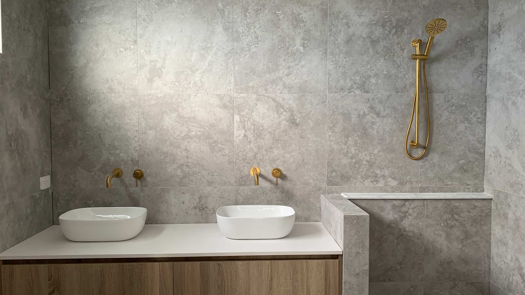 Modern & timeless custom designed bathroom ensuite with luxurious brushed brass tapware and quality finishes all around.