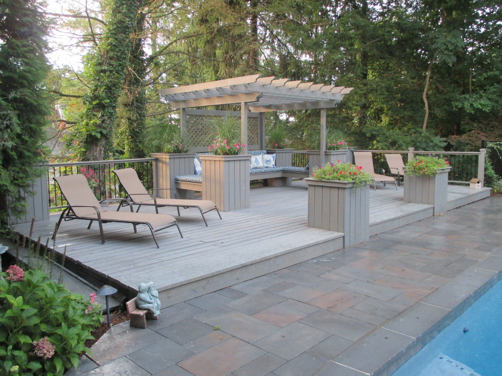 Photo of a large traditional backyard patio in New York with decking and a pergola.