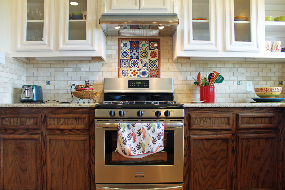 This is an example of a mid-sized u-shaped eat-in kitchen in Austin with beige splashback, terra-cotta splashback and a peninsula.