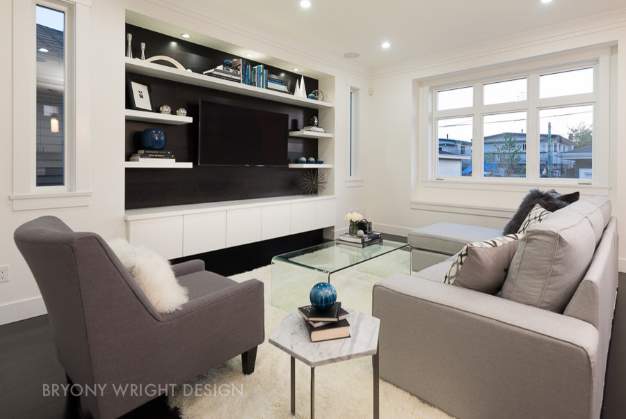 This is an example of a mid-sized modern open concept family room in Vancouver.