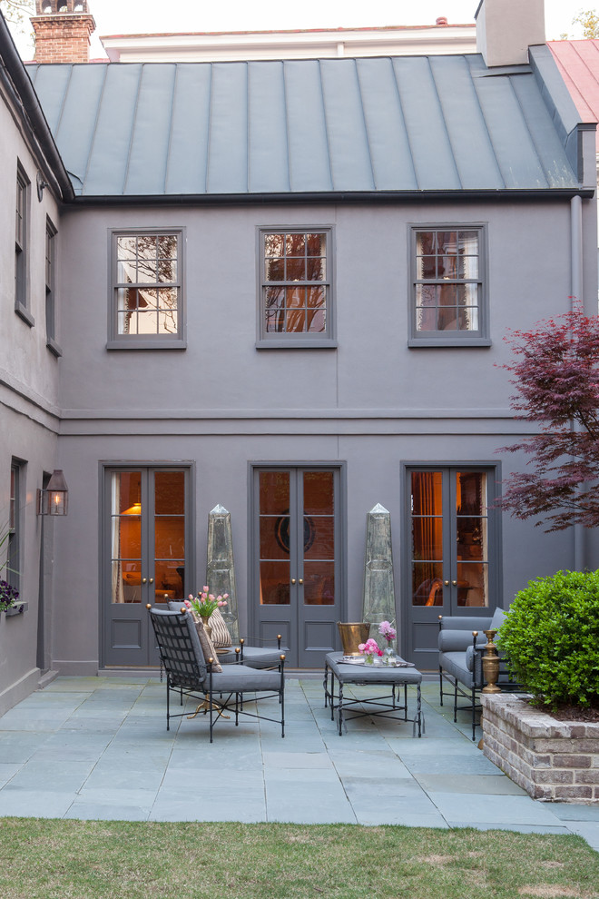 Transitional courtyard patio in Charleston with no cover.