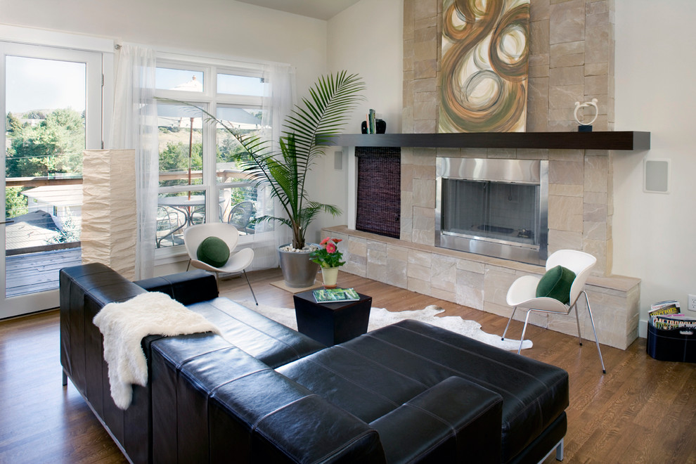 Contemporary living room in Boise with a standard fireplace.